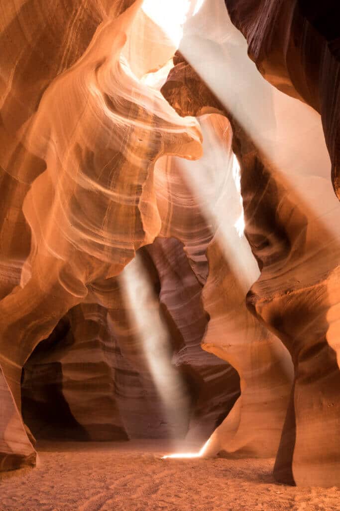 Beams of light inside Antelope Canyon. Discover the very best way to photograph Antelope Canyon. From what tour to book, to the camera settings needed for perfect pictures. And for more travel tips and wanderlust inspiration, follow The Scenic Suitcase on Pinterest!