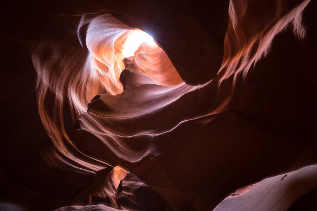 Looking up in Antelope Canyon. Discover the very best way to photograph Antelope Canyon. From what tour to book, to the camera settings needed for perfect pictures. And for more travel tips and wanderlust inspiration, follow The Scenic Suitcase on Pinterest!