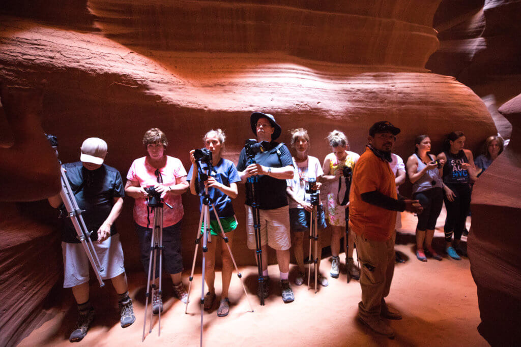 A photography tour inside Antelope Canyon. Learn why you need to book an Antelope Canyon photography tour. Which company to book for the very best shots, and what camera settings to use. And for more travel tips and wanderlust inspiration, follow The Scenic Suitcase on Pinterest!