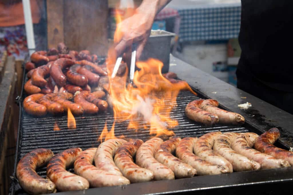 Hot dogs and brats on a fiery grill. Find out everything you need to know about the annual Denver Chalk Art Festival! What it's all about, what you can expect, and what you can't miss! And for more travel tips and wanderlust inspiration, follow The Scenic Suitcase on Pinterest!