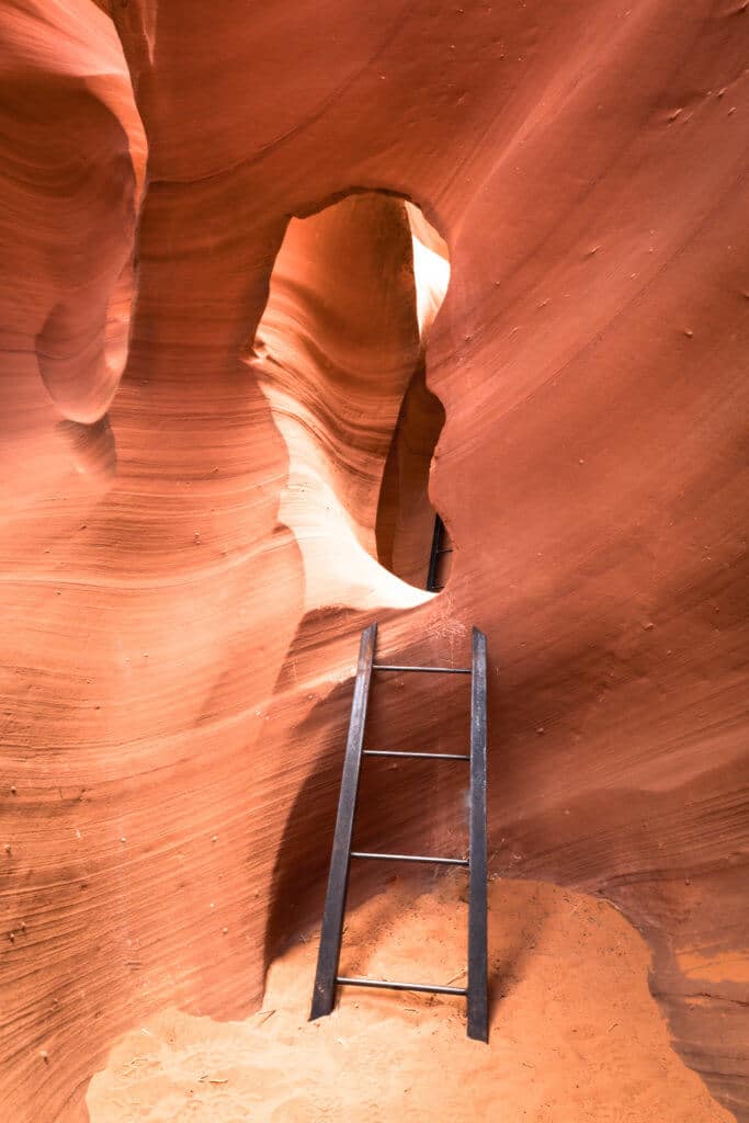 A ladder inside a slot canyon. Discover the very best way to photograph Antelope Canyon. From what tour to book, to the camera settings needed for perfect pictures. And for more travel tips and wanderlust inspiration, follow The Scenic Suitcase on Pinterest!