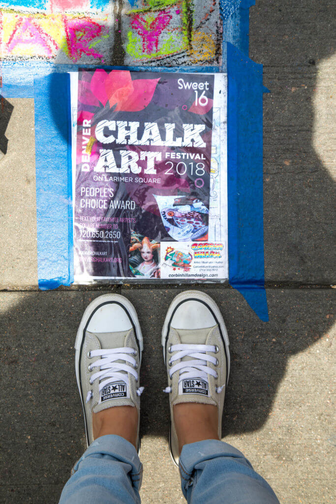 Girl's feet in converse standing next to a Chalk Art Festival flyer. Find out everything you need to know about the annual Denver Chalk Art Festival! What it's all about, what you can expect, and what you can't miss! And for more travel tips and wanderlust inspiration, follow The Scenic Suitcase on Pinterest!