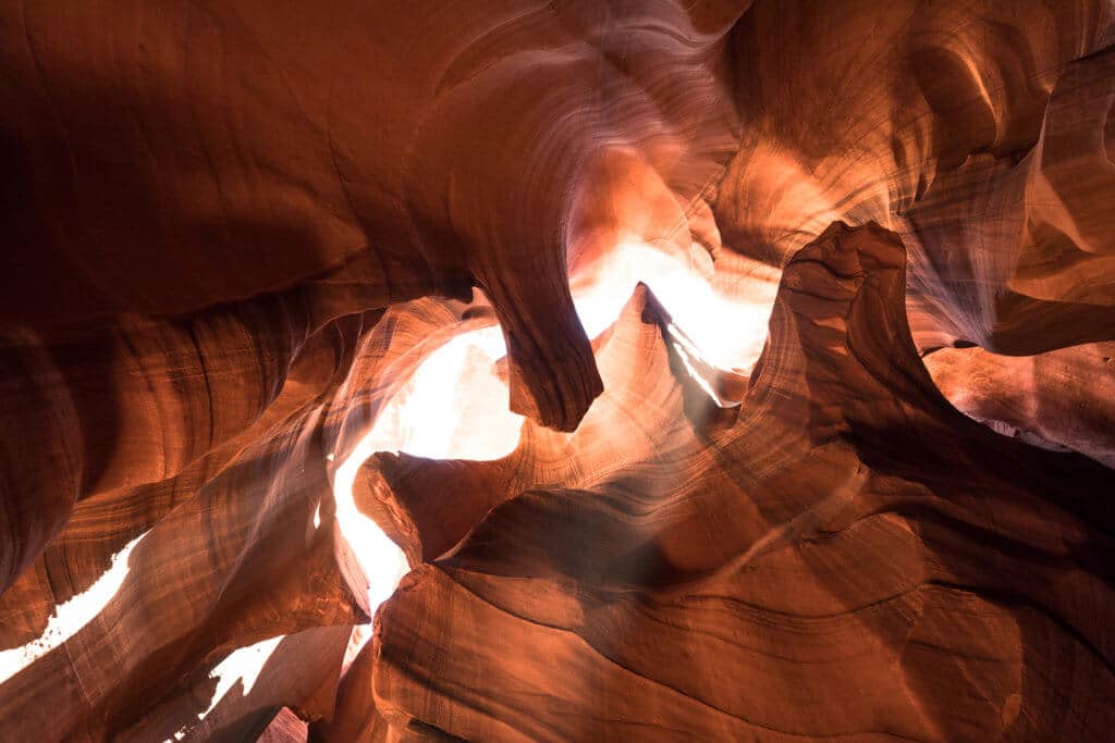 Looking up at the ceiling of Antelope Canyon. Discover some of the most beautiful places in the American Southwest. Awe-inspiring destinations and what you shouldn't miss on your next road trip! And for more travel tips and wanderlust inspiration, follow The Scenic Suitcase on Pinterest!