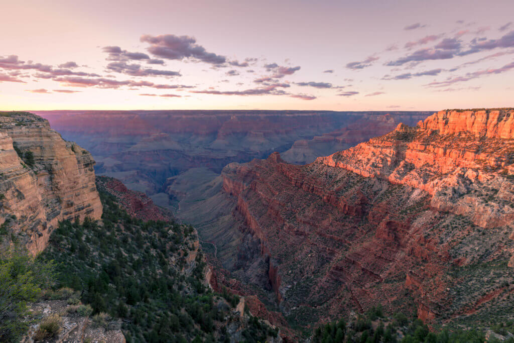 Sunset over the Grand Canyon. Discover some of the most beautiful places in the American Southwest. Awe-inspiring destinations and what you shouldn't miss on your next road trip! And for more travel tips and wanderlust inspiration, follow The Scenic Suitcase on Pinterest!