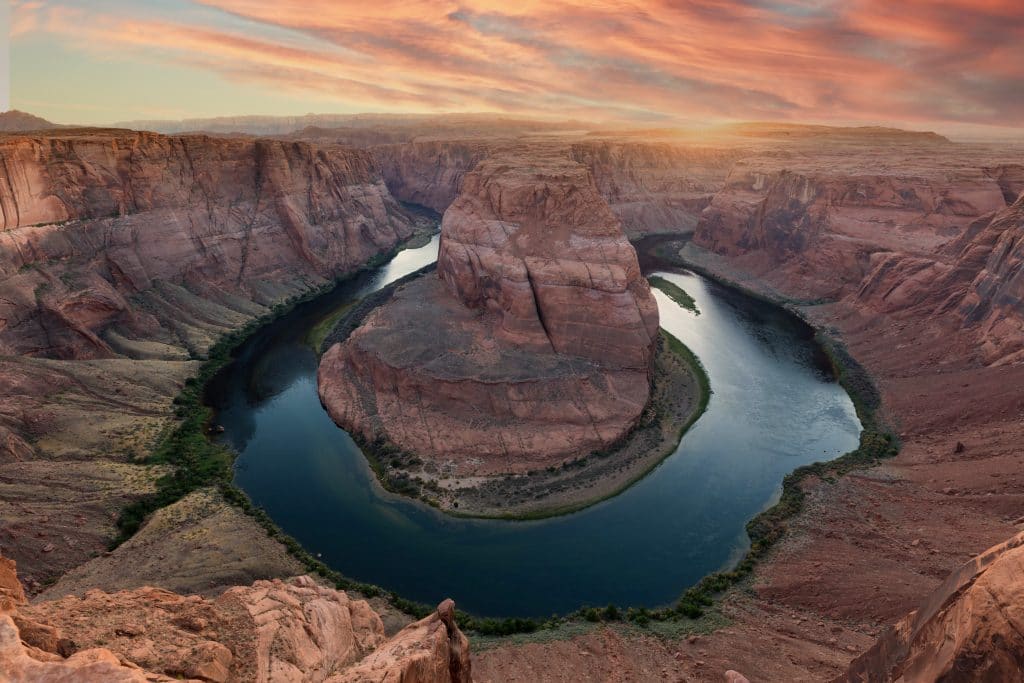 Sunset over Horseshoe Bend. Discover some of the most beautiful places in the American Southwest. Awe-inspiring destinations and what you shouldn't miss on your next road trip! And for more travel tips and wanderlust inspiration, follow The Scenic Suitcase on Pinterest!