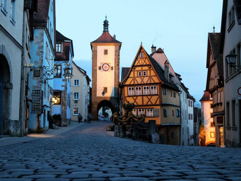 A deserted street in Rothenburg ob der Tauber, Germany at night. Use these secret travel hacks for better flights, hotels, and cruises! Along with tips on how to avoid lines, pick the best travel destinations, and more! And for more travel tips and wanderlust inspiration, follow The Scenic Suitcase on Pinterest!