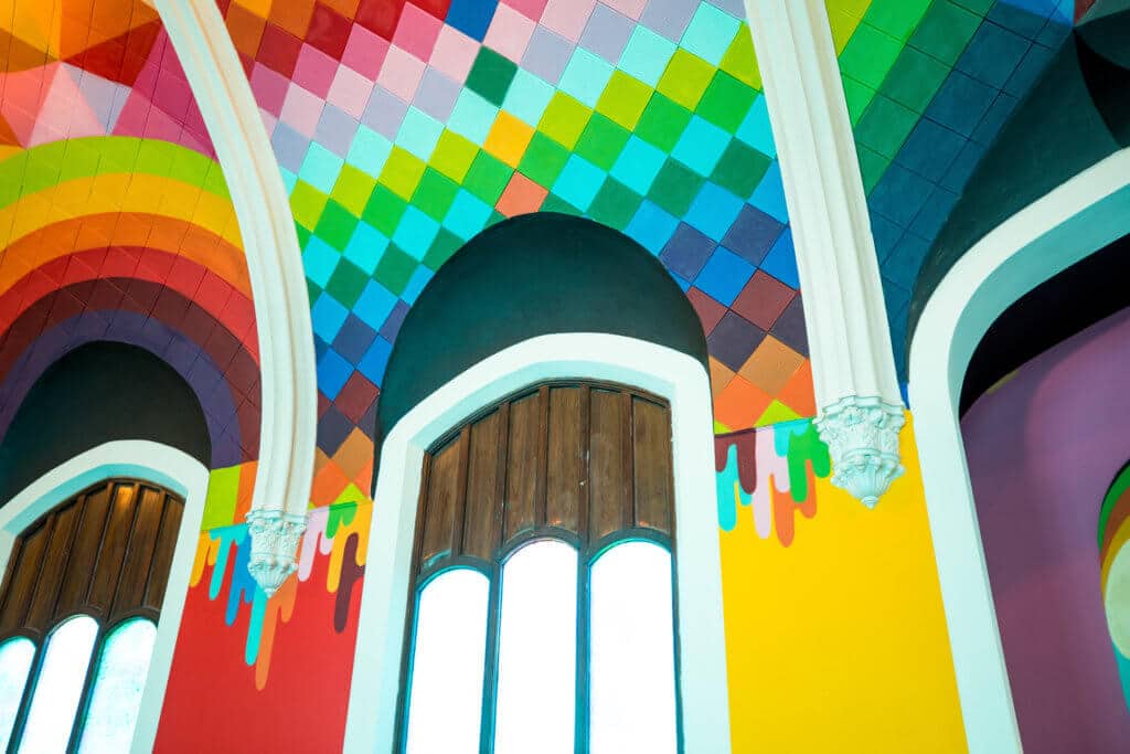 The colorful interior of the International Church of Cannabis. Discover the most stunning, offbeat, and unique places in Colorado. Including cliff diving dinner entertainment, haunted hotels, towering dunes, and more! And for additional travel tips and wanderlust inspiration, follow The Scenic Suitcase on Pinterest!