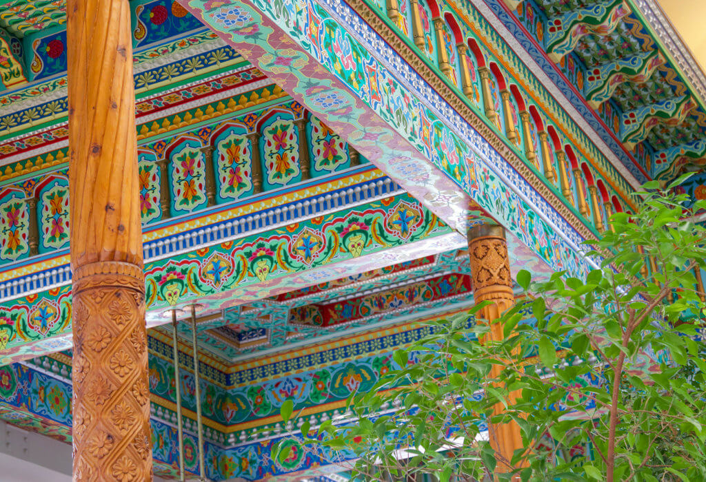 The colorful ceiling and carved pillars at the Boulder Dushanbe Teahouse. Discover the most stunning, offbeat, and unique places in Colorado. Including cliff diving dinner entertainment, haunted hotels, towering dunes, and more! And for additional travel tips and wanderlust inspiration, follow The Scenic Suitcase on Pinterest!