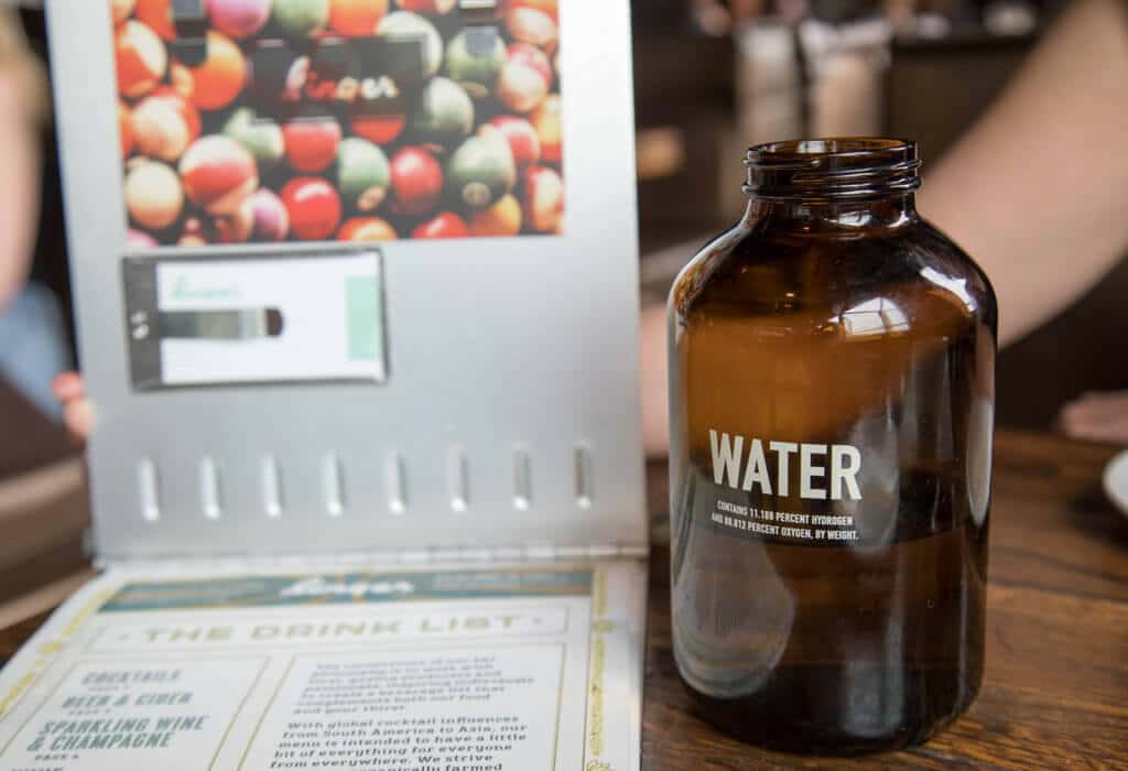 A water bottle and drink menu from Linger. Discover the most stunning, offbeat, and unique places in Colorado. Including cliff diving dinner entertainment, haunted hotels, towering dunes, and more! And for additional travel tips and wanderlust inspiration, follow The Scenic Suitcase on Pinterest!