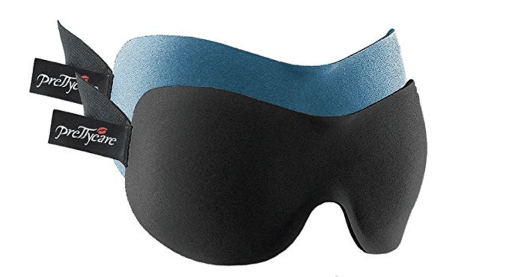 Black and blue eye masks. Discover the top 10 travel essentials every globetrotter needs. These helpful (and sometimes surprising) accessories will transform the way you travel! And for more travel tips and wanderlust inspiration, follow The Scenic Suitcase on Pinterest!
