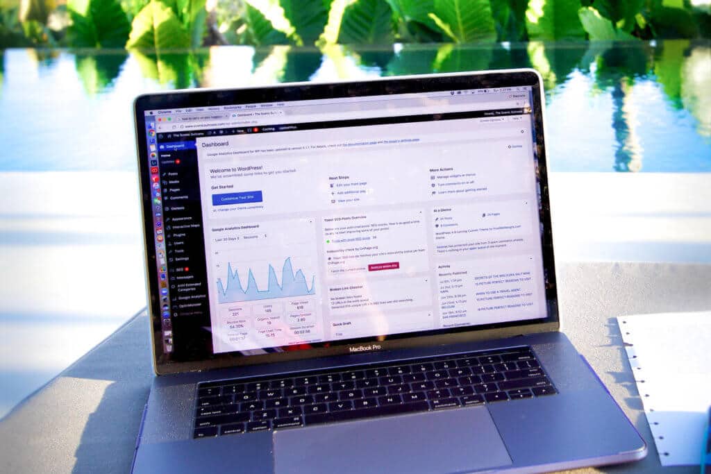 A computer near a tropical pool. After 100 posts, discover unexpected life lessons learned from blogging. Transformative changes, shocking realizations, and what it really takes to succeed. And for travel tip and wanderlust inspiration, follow The Scenic Suitcase on Pinterest!