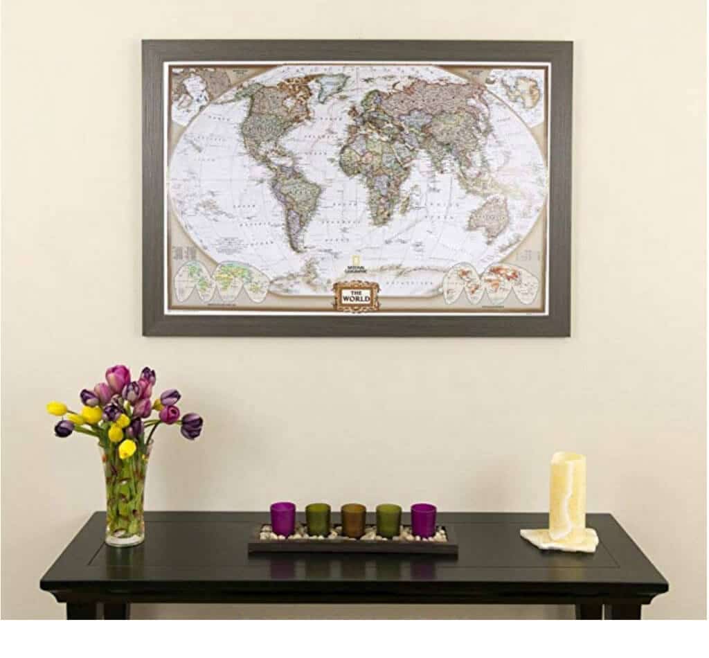 A pinnable map hanging above a table with candles and flowers. Stylish, afforable, and fun travel inspired home decor that's perfect for anyone with a serious case of wanderlust. Find that perfect accent for your home! And for more travel tips and wanderlust inspiration, follow The Scenic Suitcase on Pinterest!