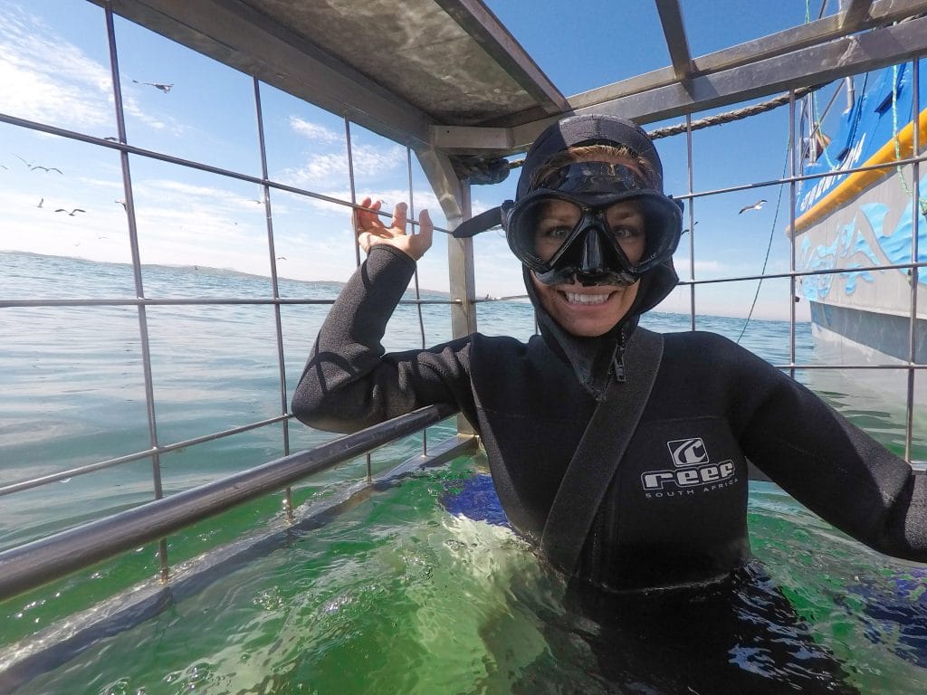 A girl in a cage during a great white shark dive. See the most picture perfect moments of 2018. From London to Cape Town to Las Vegas and more, see what you can't miss in these incredible destinations! And for more travel tips and wanderlust inspiration, follow The Scenic Suitcase on Pinterest!