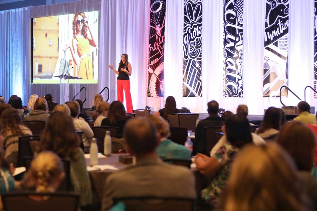 A woman speaking at a conference. See the most picture perfect moments of 2018. From London to Cape Town to Las Vegas and more, see what you can't miss in these incredible destinations! And for more travel tips and wanderlust inspiration, follow The Scenic Suitcase on Pinterest!