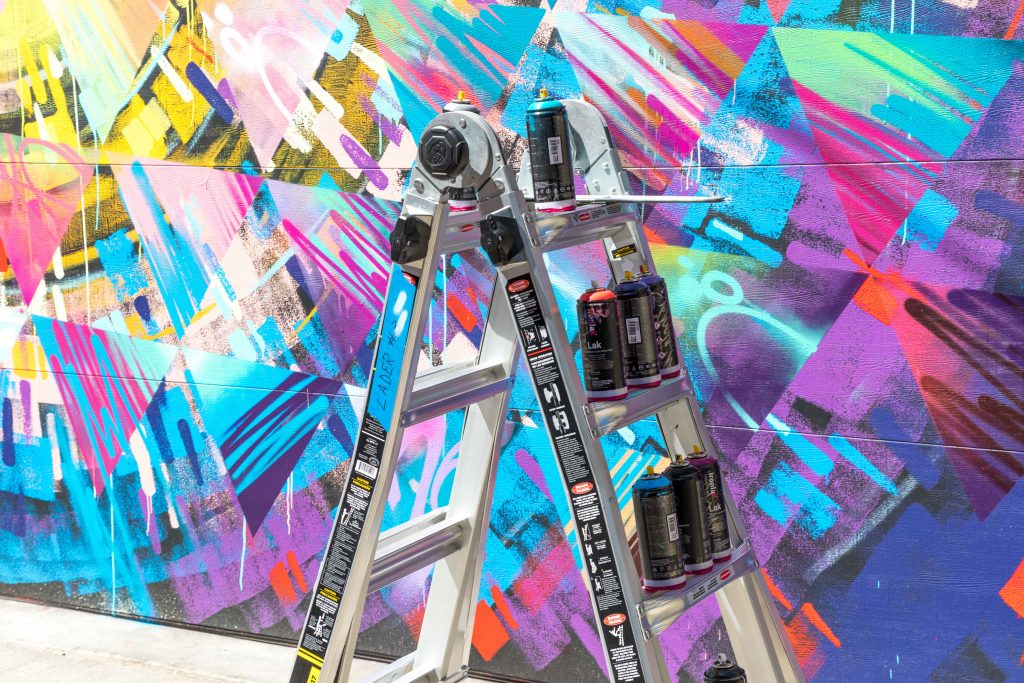 Spray paint cans in front of a brightly colored garage door. See the most picture perfect moments of 2018. From London to Cape Town to Las Vegas and more, see what you can't miss in these incredible destinations! And for more travel tips and wanderlust inspiration, follow The Scenic Suitcase on Pinterest!