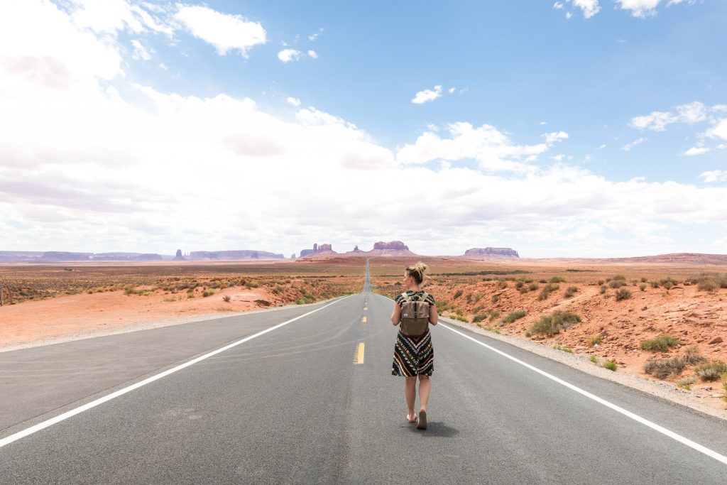 A girl walking down a long road. See the most picture perfect moments of 2018. From London to Cape Town to Las Vegas and more, see what you can't miss in these incredible destinations! And for more travel tips and wanderlust inspiration, follow The Scenic Suitcase on Pinterest!