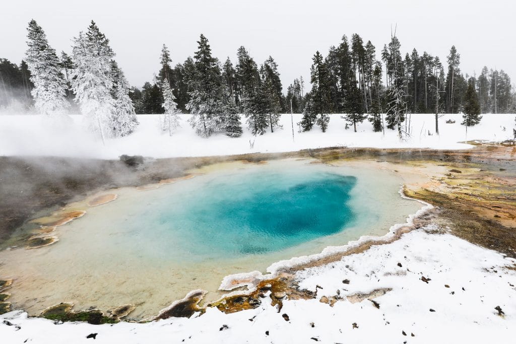 The rainbow waters of Silex Spring in Yellowstone National Park. See the most picture perfect moments of 2018. From London to Cape Town to Las Vegas and more, see what you can't miss in these incredible destinations! And for more travel tips and wanderlust inspiration, follow The Scenic Suitcase on Pinterest!