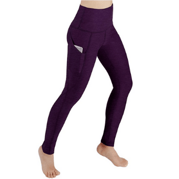 Purple yoga pants. Discover long-haul flight essentials that will make your trip a dream instead of a nightmare. Includes everything you need to enjoy your time in the air! And for more travel tips, follow The Scenic Suitcase on Pinterest!