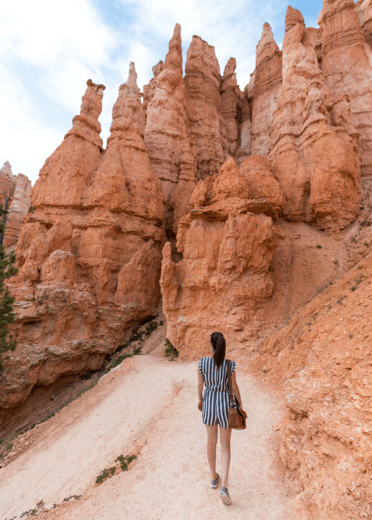 Girl walking through Bryce Canyon. Discover the 10 best U.S. National Parks you should definitely add to your bucket list.