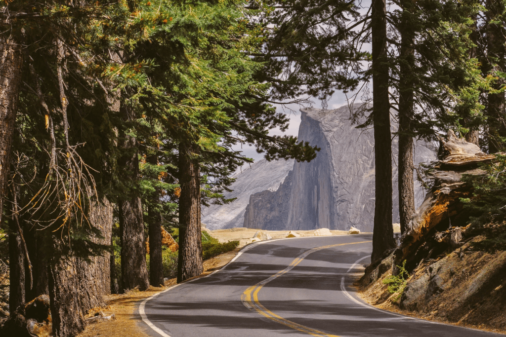 A road with half dome in the background.