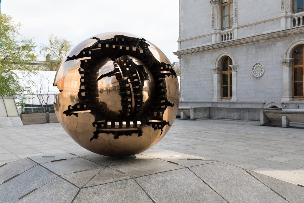 Golden sphere sculpture at Trinity College. #TrinityCollege