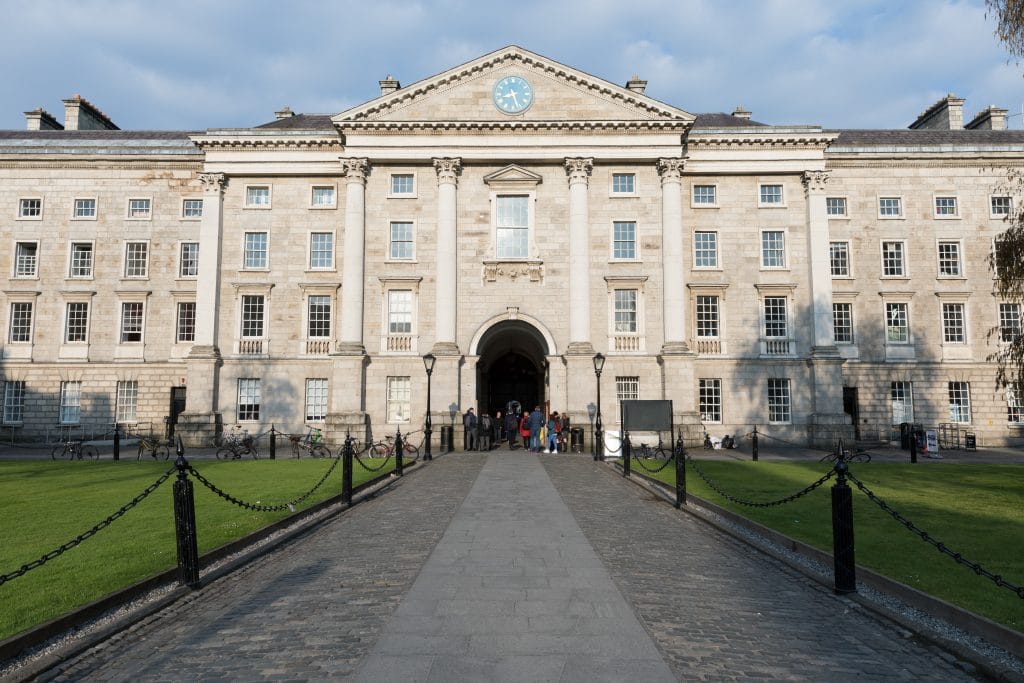 A white stone building with a large archway at Trinity College. #TrinityCollege