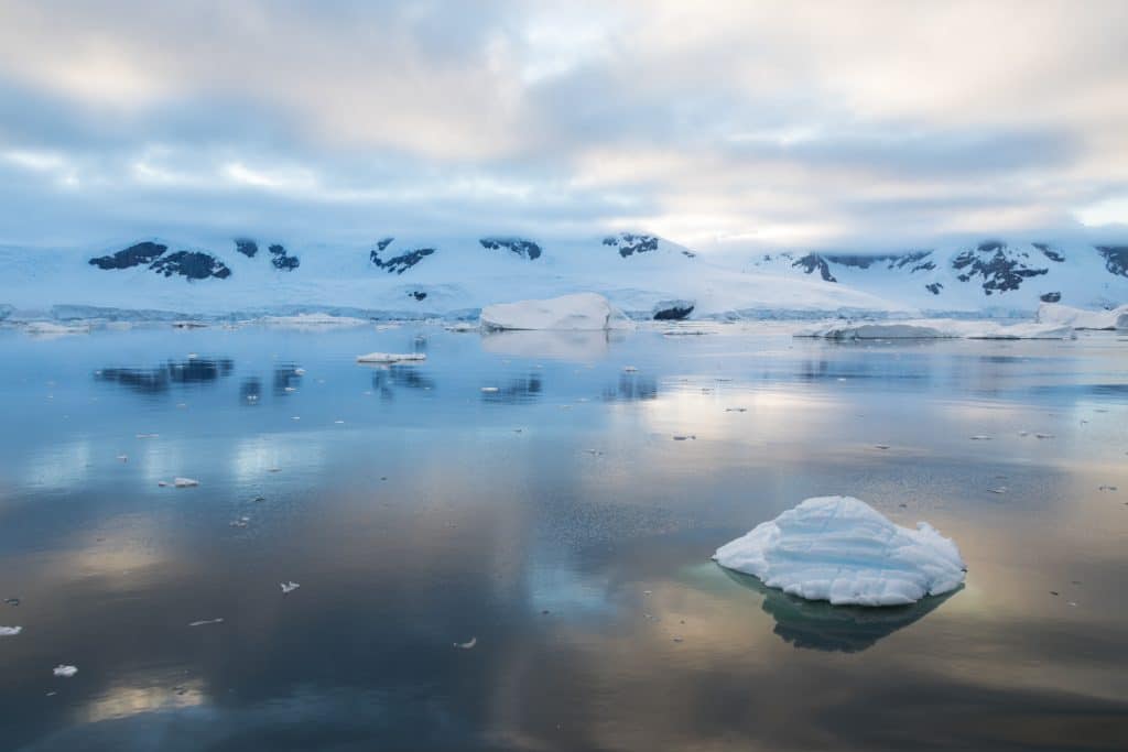 The reflection of mountains against the water in Antarctica. #antarctica