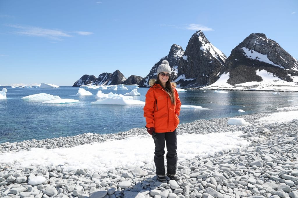 A girl standing on the rocky shore in Antarctica. One of the picture perfect moments of 2019. #antarctica