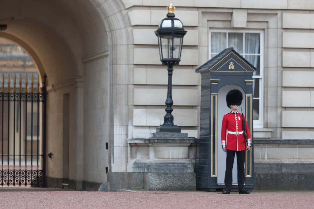 A red-coated guard at Buckingham Palace. One of the picture perfect moments of 2019. #london #changingoftheguard