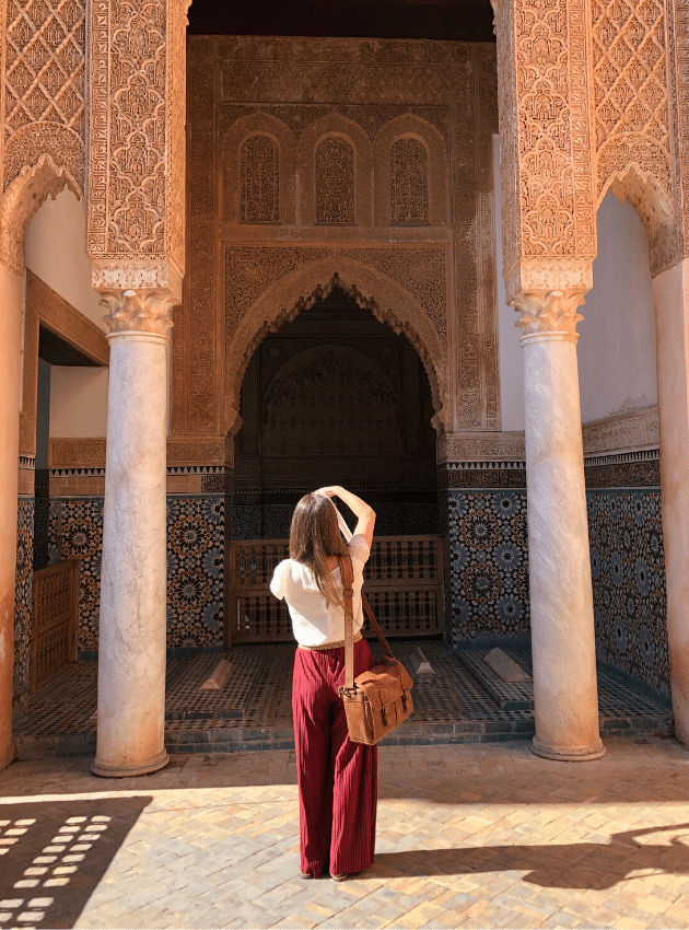 A girl taking a picture of a temple in Morocco. #marrakesh #morocco