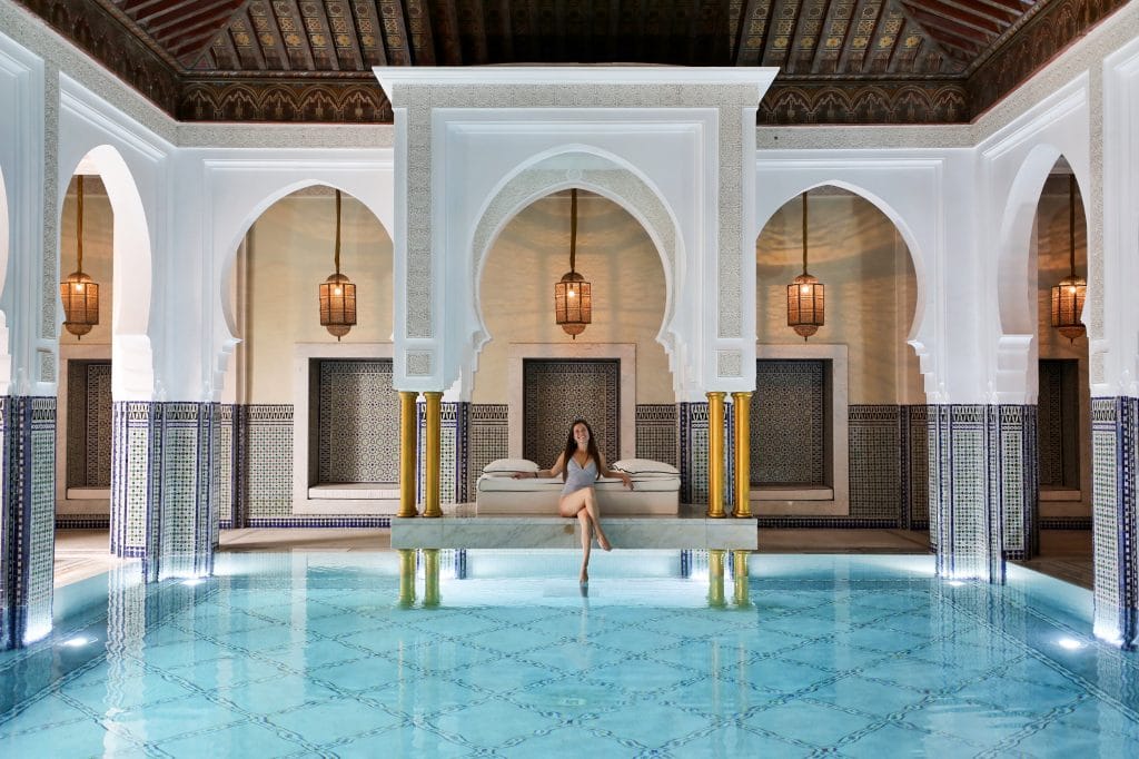 A girl sitting poolside at an indoor pool in Morocco. One of the picture perfect moments of 2019. #lamomouia #marrakesh