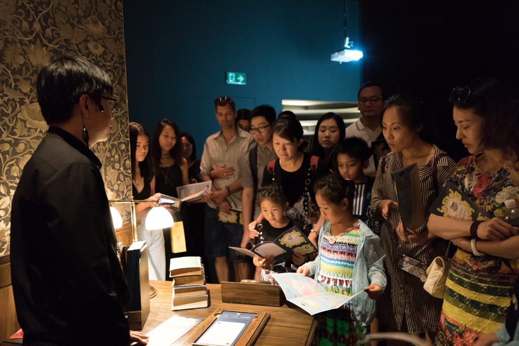People listening to instructions at the ArtScience Museum in Singapore. #singapore #artsciencemuseum