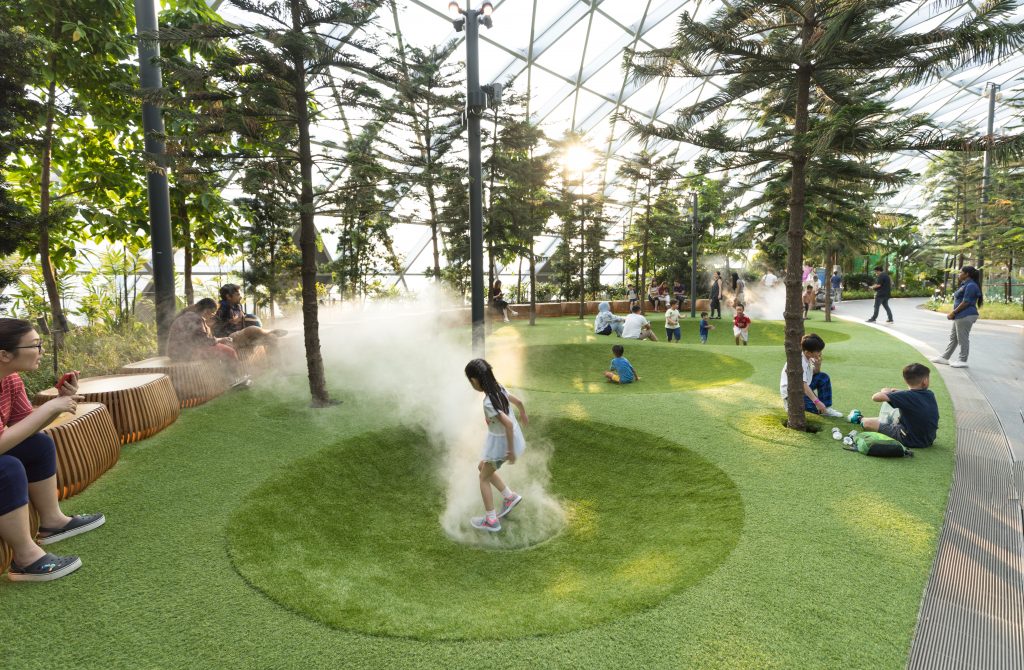 A little girl running through steam at the Changi airport. #changi #changiairport #changijewel