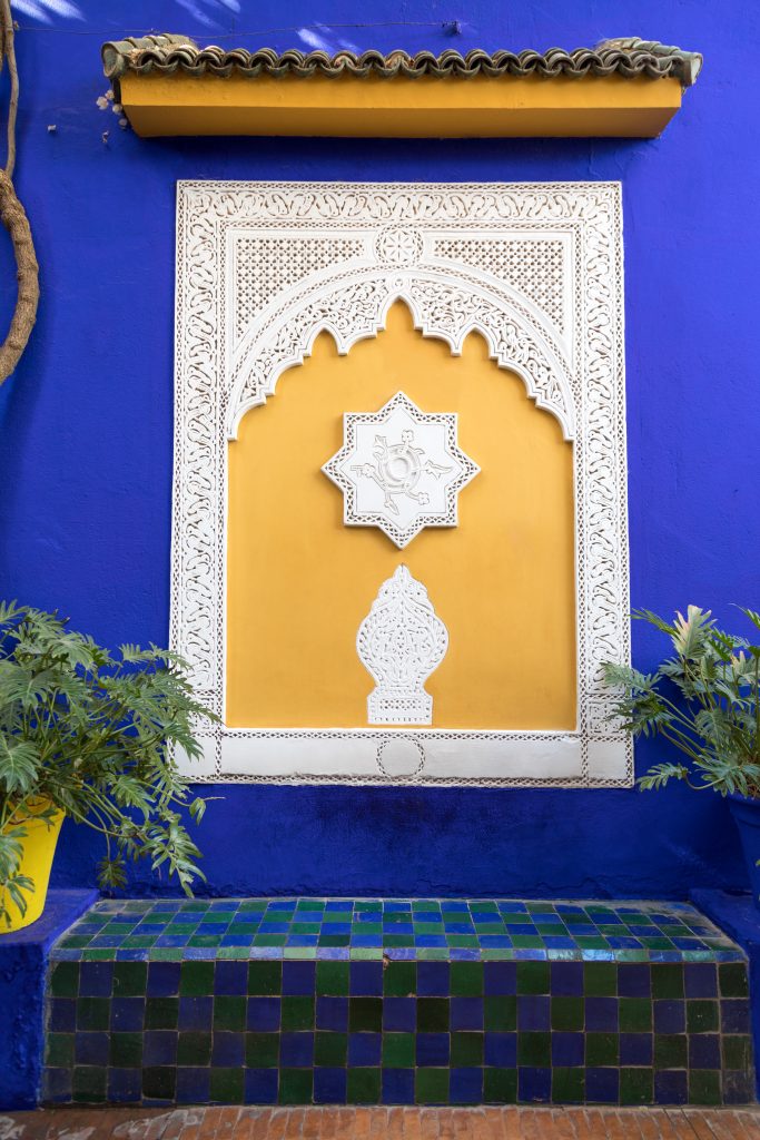 A decorative wall with plants in Jardin Majorelle. #marrakesh #jardinmajorelle