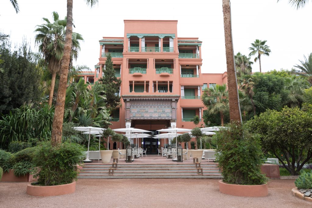The exterior of a hotel as seen from lush gardens. #marrakesh #lamamounia