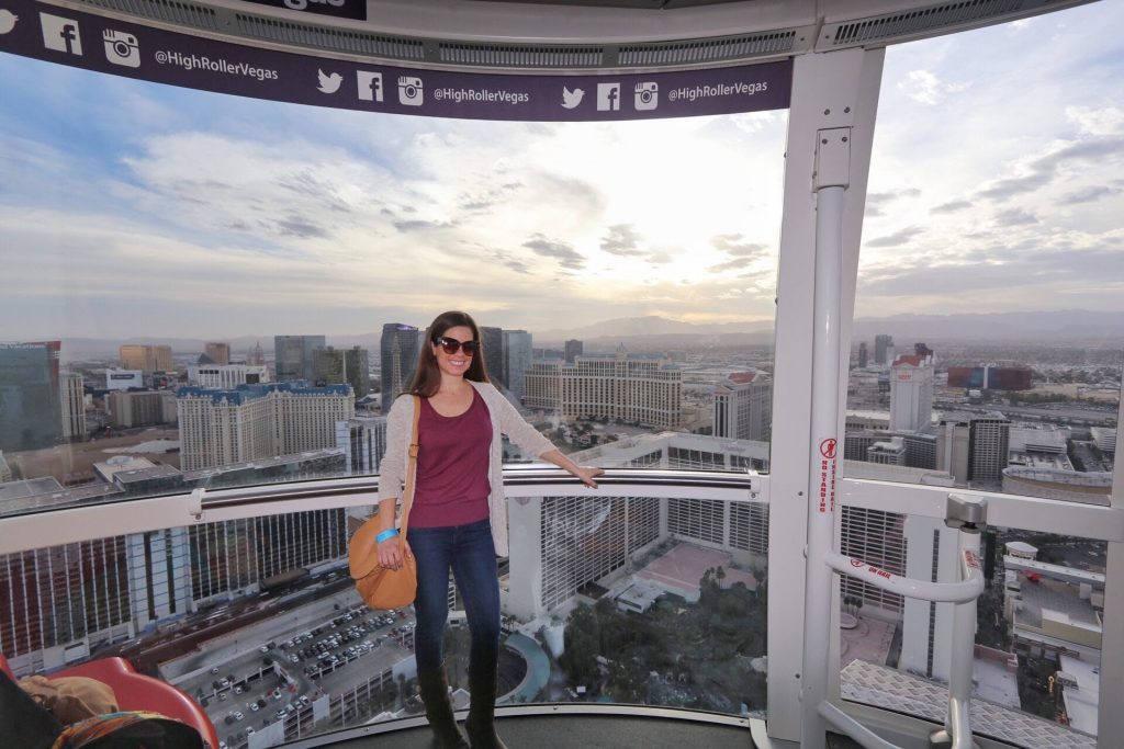 A girl riding on the High Roller ferris wheel.