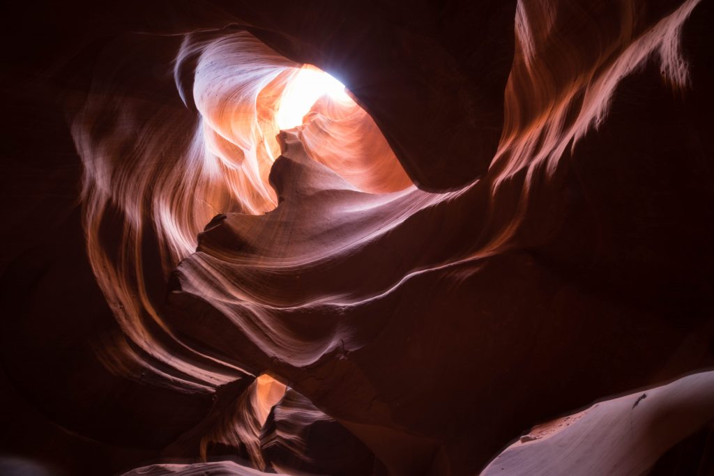 Looking up inside a slot canyon. Antelope Canyon is one of the most stunning bucket list destinations in the world. #bucketlistdestinations