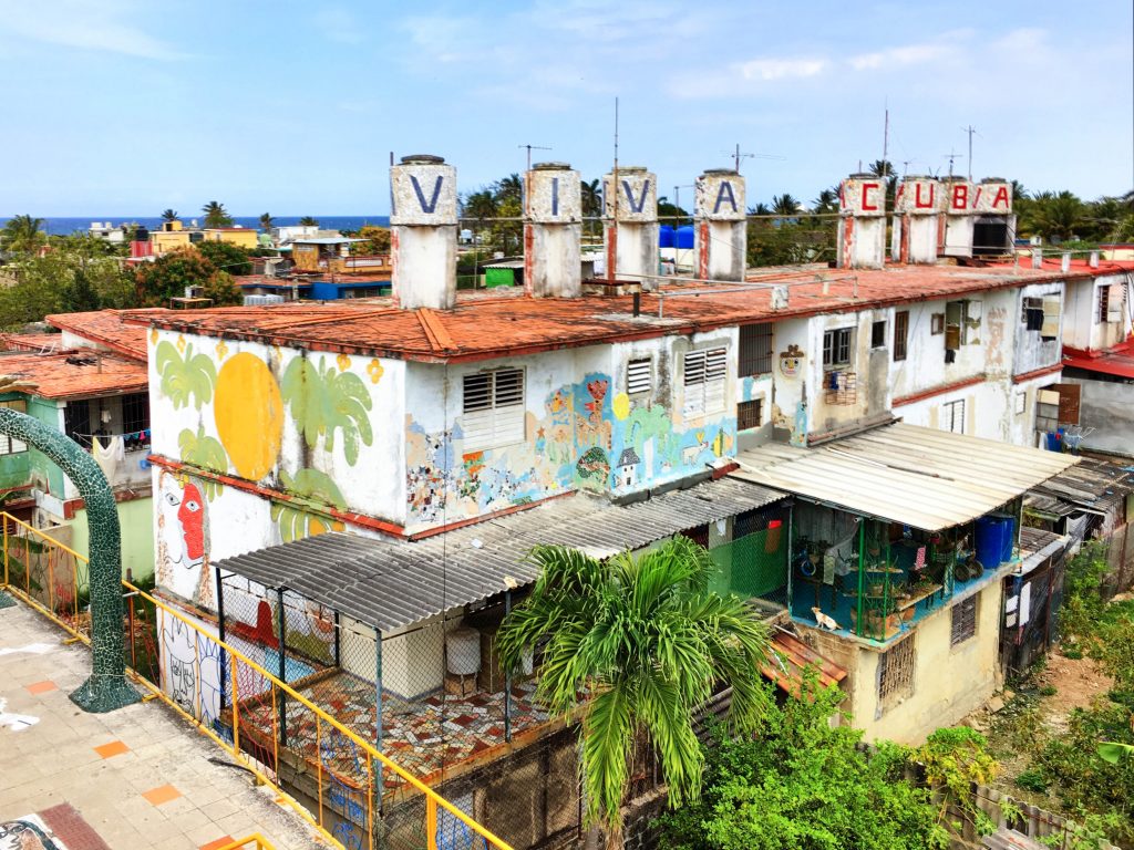 A graffiti-filled building fascade in Havana, Cuba. It is one of the most stunning bucket list destinations in the world. #bucketlistdestinations
