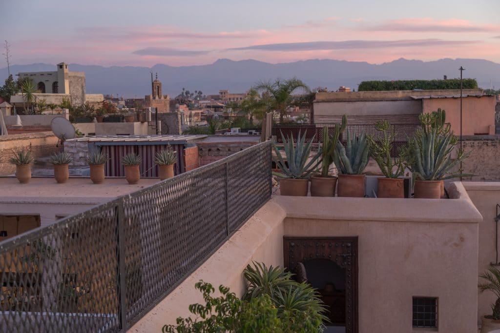 A riad rooftop terrace at sunset in Marrakesh. #thingstoknowbeforevisitingmarrakesh