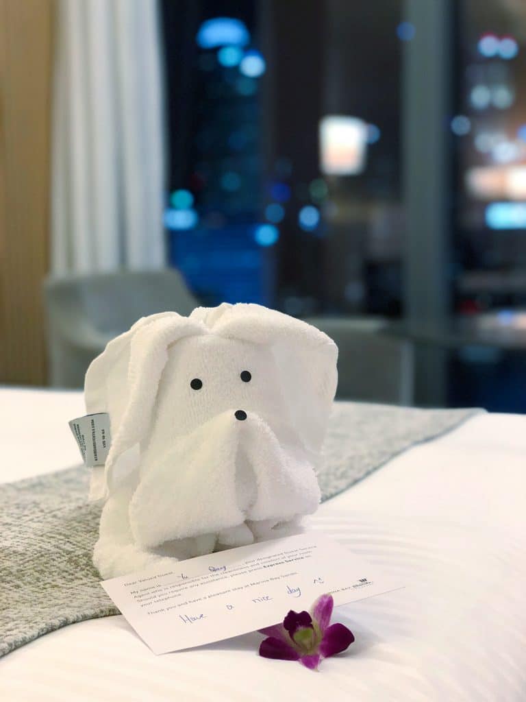 A dog made out of towels next to an orchid. Find out what it's really like to stay at the Marina Bay Sands Singapore. What to expect, what's nearby, and what you shouldn't miss!