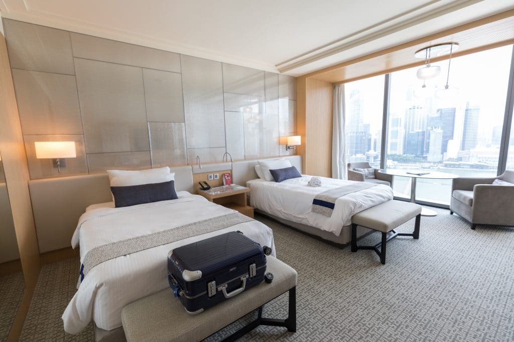 Two beds inside a hotel room at the Marina Bay Sands Singapore. Find out what it's really like to stay at the Marina Bay Sands Singapore. What to expect, what's nearby, and what you shouldn't miss!
