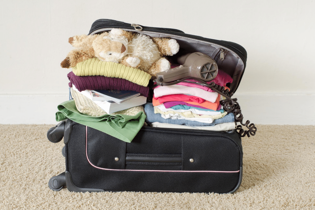 A fully packed suitcase. Learn expert tips to help you prepare for vacation so you can truly enjoy your time away. 