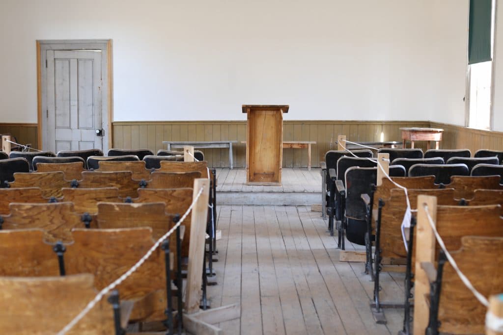 Pews and a pulpit inside a church in the ghost town of Bannack Montana.