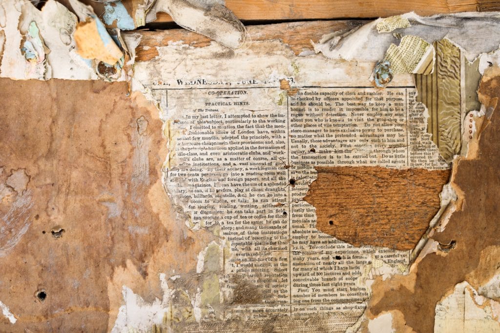 Layers of wallpaper and newspaper inside an abandon cabin in Bannack, Montana.