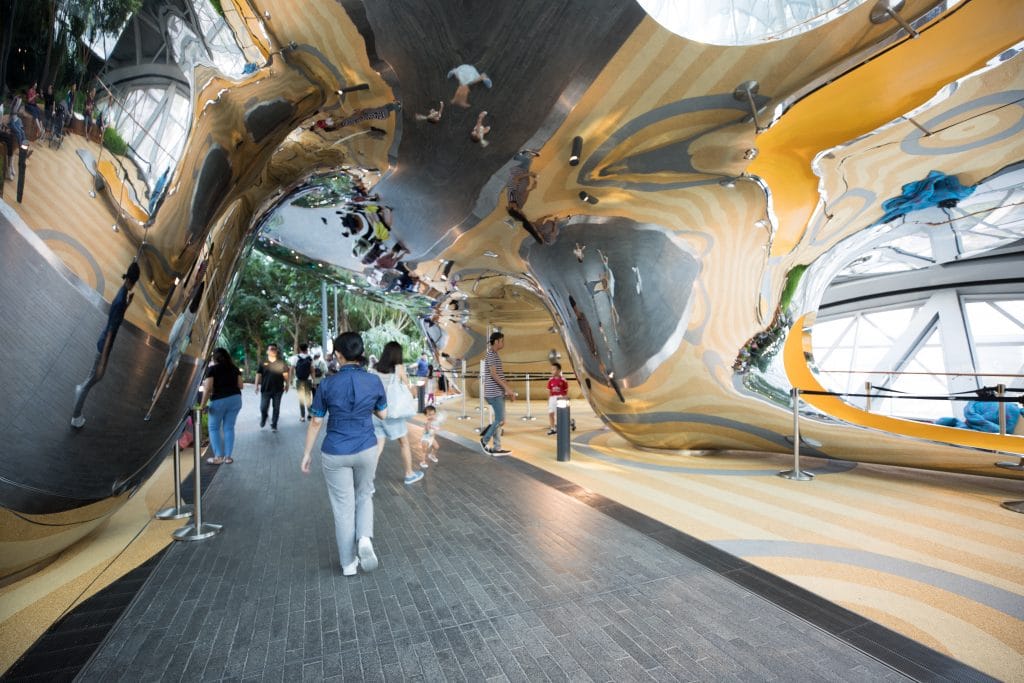 A mirrored sculpture and slide at the Jewel inside Changi Airport in Singapore. #changiairport #canopypark