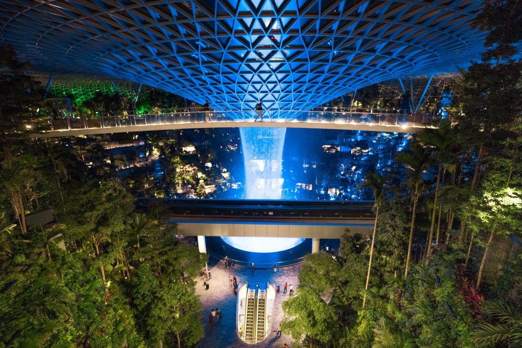 A person walking across the Canopy Bridge inside the Jewel at Changi Airport. #changiairport #jewelsingapore