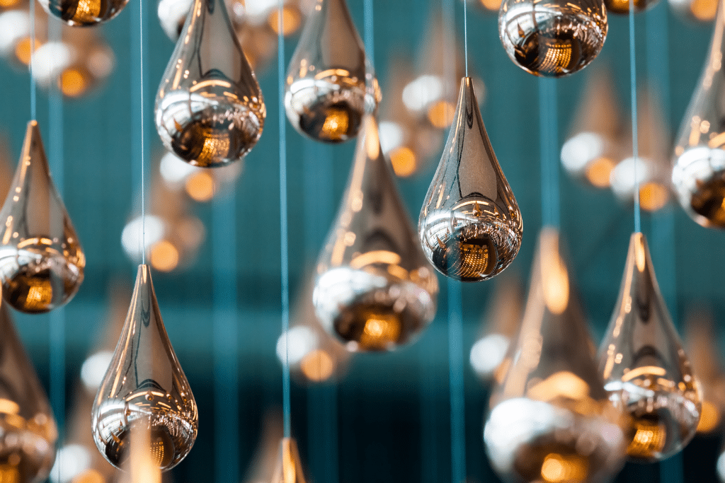 A closeup of the copper raindrops in the Kinetic Rain sculpture at the Changi Airport.