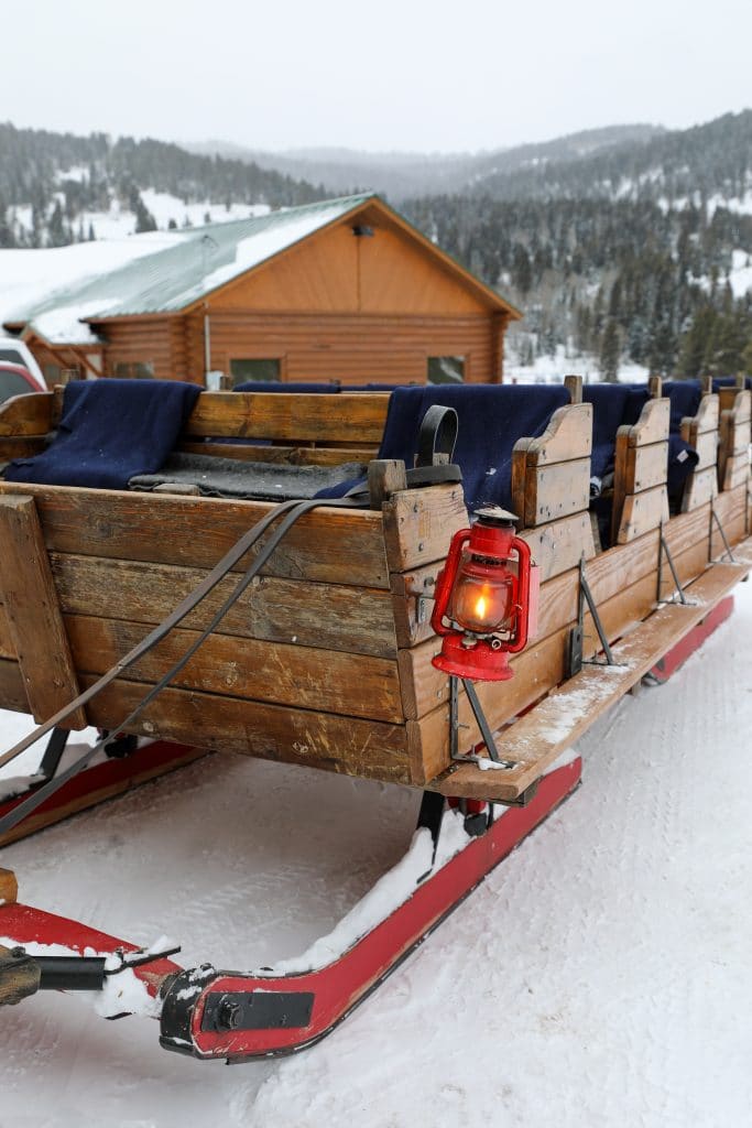 A sleigh with lanterns for lights at the 320 Guest Ranch. #320guestranch