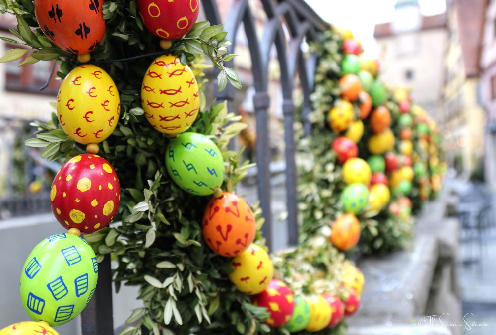 Easter eggs decorating an iron fence. Discover why Rothenburg ob der Tauber in Germany is a must for your fairytale bucket list (and what you can't miss while you're there!)