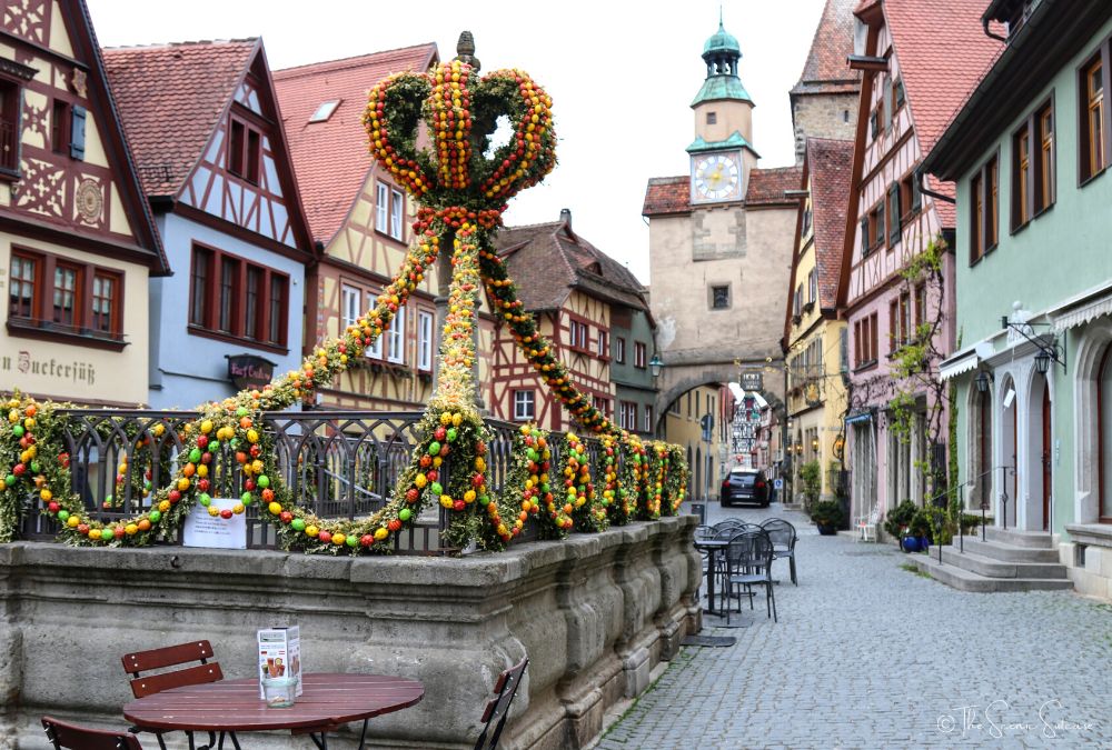 Easter eggs around a fountain in the middle of a town square. Discover why Rothenburg ob der Tauber in Germany is a must for your fairytale bucket list (and what you can't miss while you're there!)